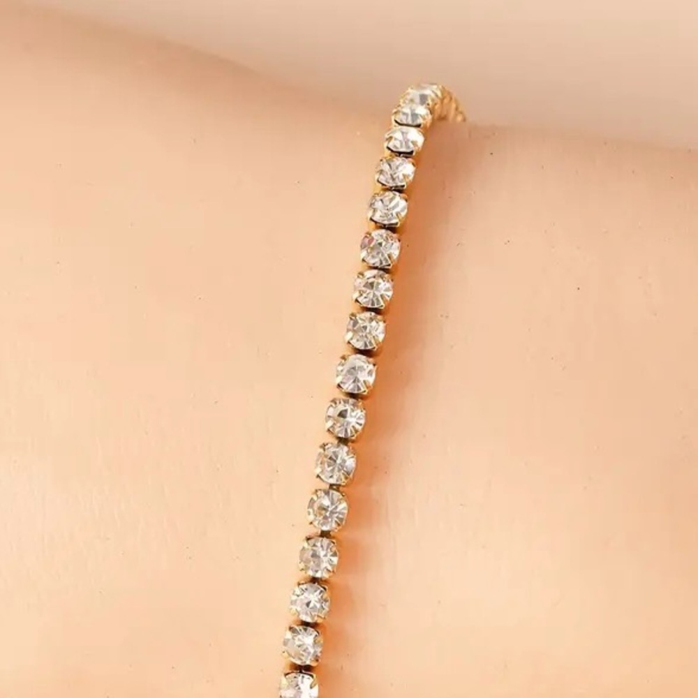Tennis Bracelet Featuring Rhinestones Set In 18K Gold Plated Stainless Steel